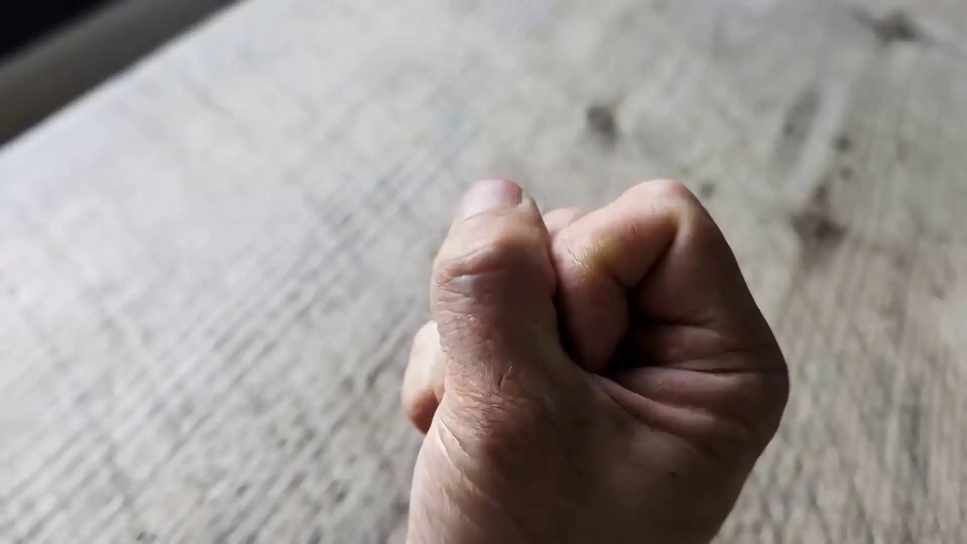 Hand opens to reveal a miniature solar system with orbiting bronze planets, created with Gemini Omni Flash image-to-video